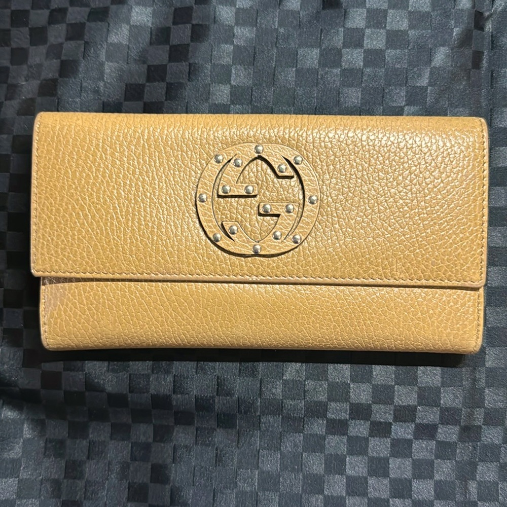 Authentic GUCCI pebble tan gold leather, double G studded emblem snap wallet